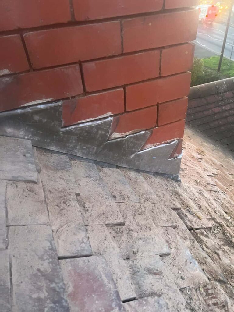 This is a photo of new leadwork being installed around an old chimney. Works carried out by Wigston Roofing Repairs